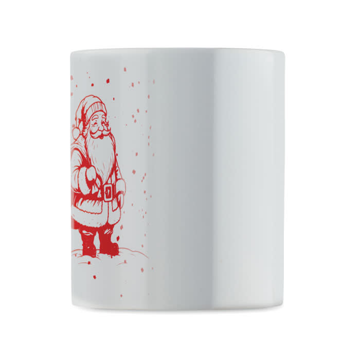A white mug featuring a red illustration of Santa Claus with a snowy backdrop.