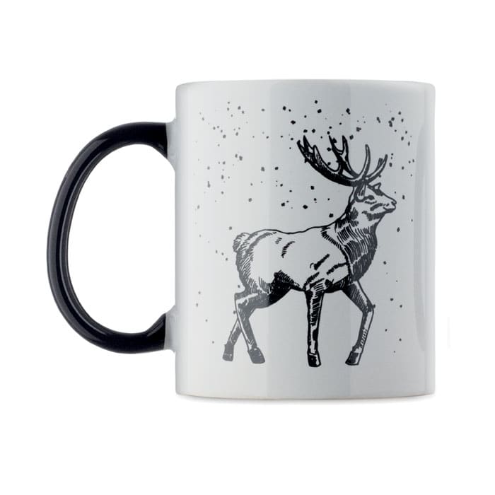 A white mug with a black handle featuring a black illustration of a reindeer against a speckled background.