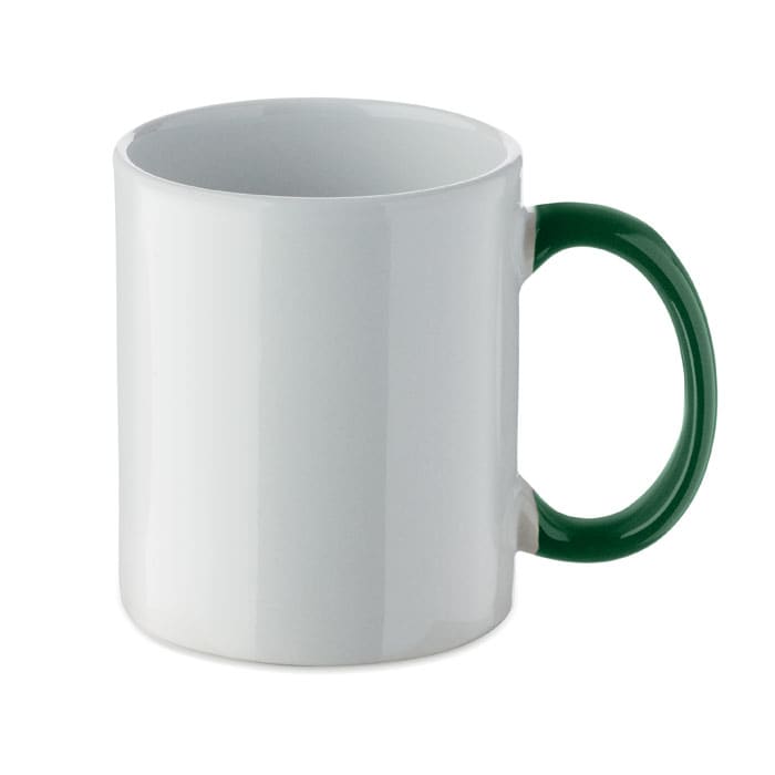 A white mug with a green handle and a smooth surface, featuring a logo on one side.