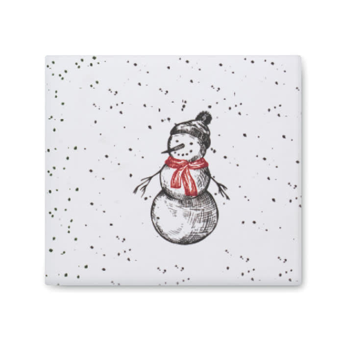 A festive white coaster featuring a snowman with a red scarf, black hat, and dotted snowflake pattern.