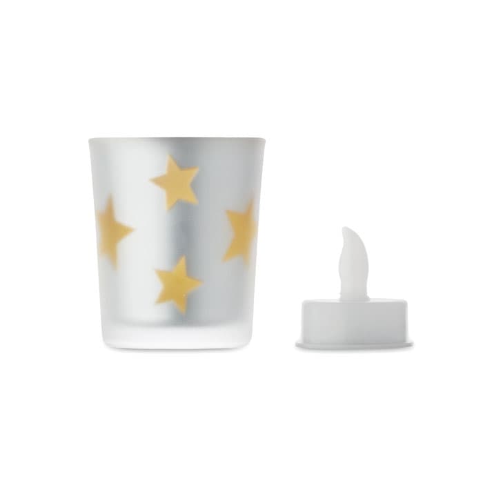 A candle holder with a frosted glass finish, featuring yellow stars, alongside a removable white candle.