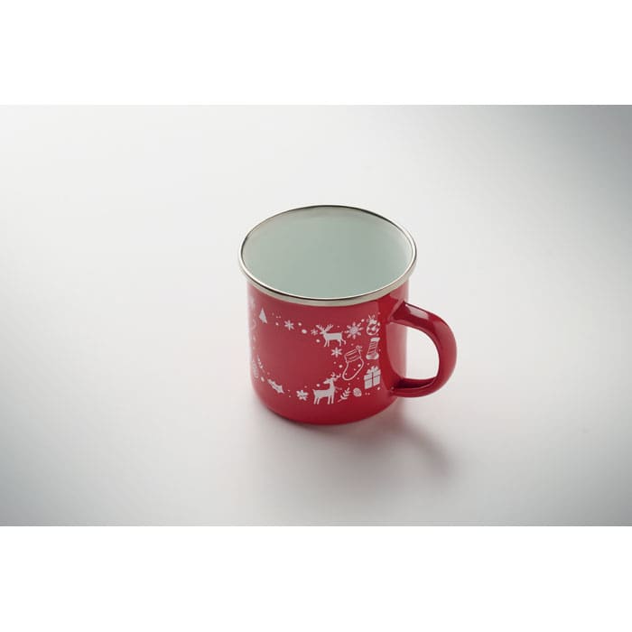 A red drink mug with festive white designs and a silver inner lining, featuring a handle for easy grip.