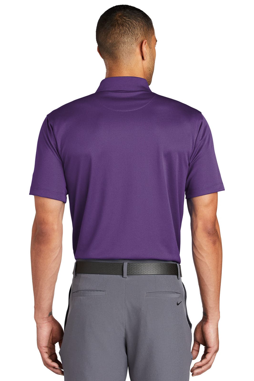 A purple Nike Tech Basic Dri-FIT polo shirt, featuring a collar and short sleeves, displayed from the back.