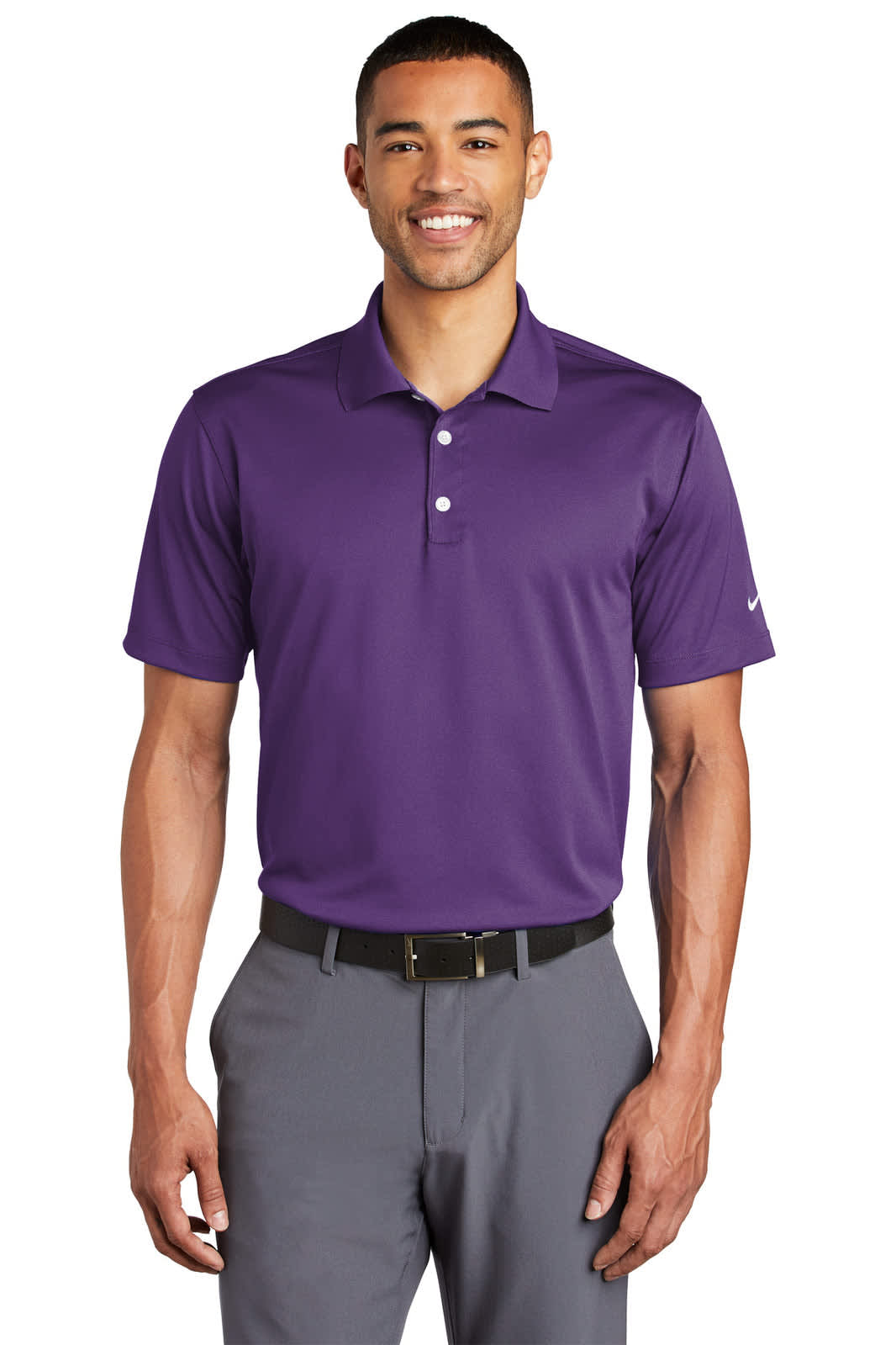 A purple Nike Tech Basic Dri-FIT polo shirt featuring a branded logo, styled with grey trousers.