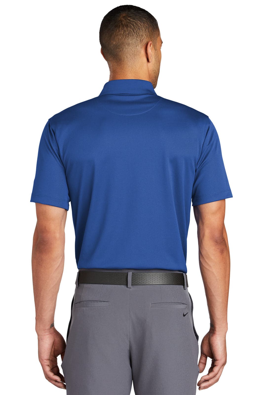 A blue Nike Tech Basic Dri-FIT polo shirt featuring a short sleeve design and a collar, with a logo on the back.
