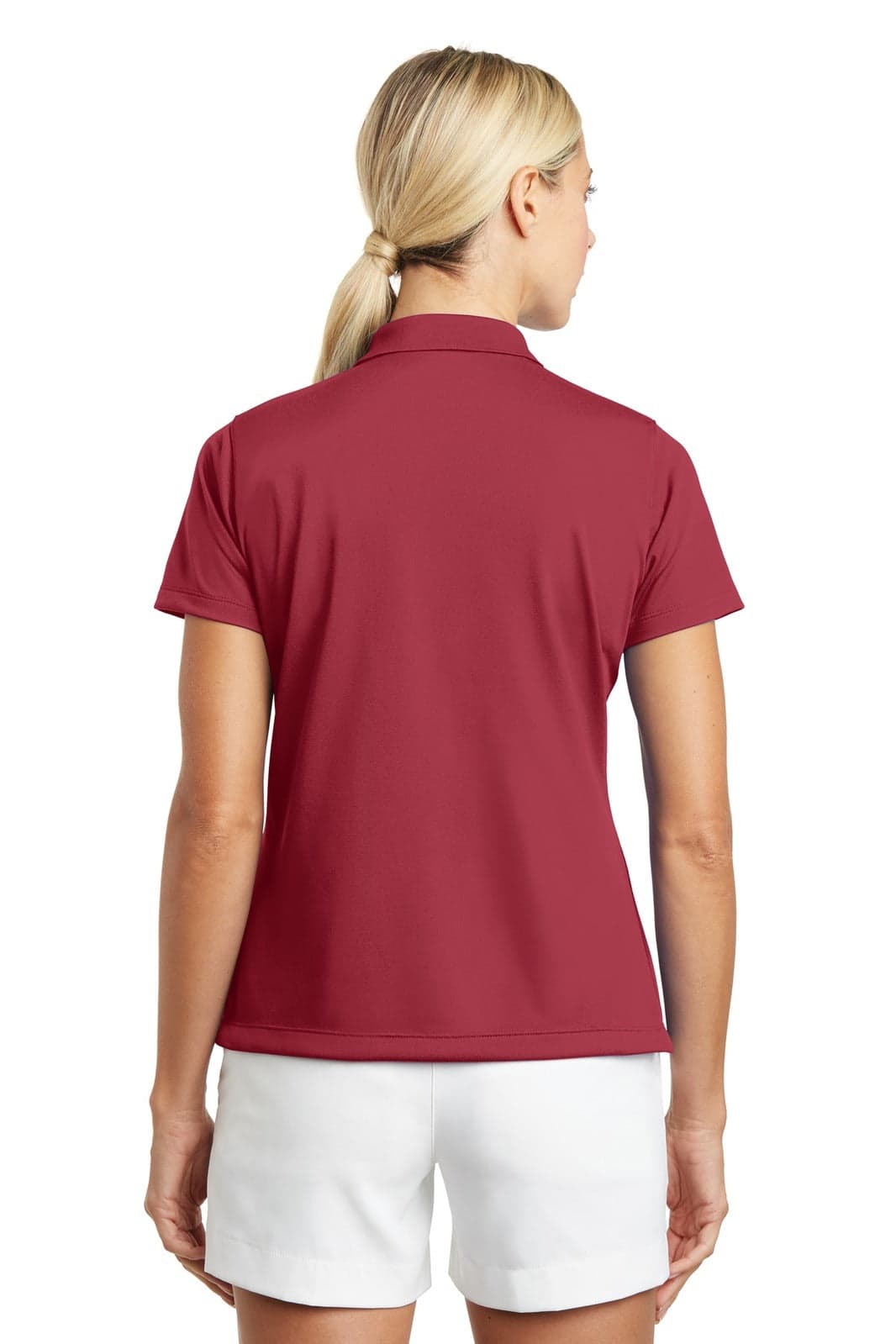 A burgundy polo shirt with a short sleeve design, featuring a logo on the back. The model is wearing white shorts.