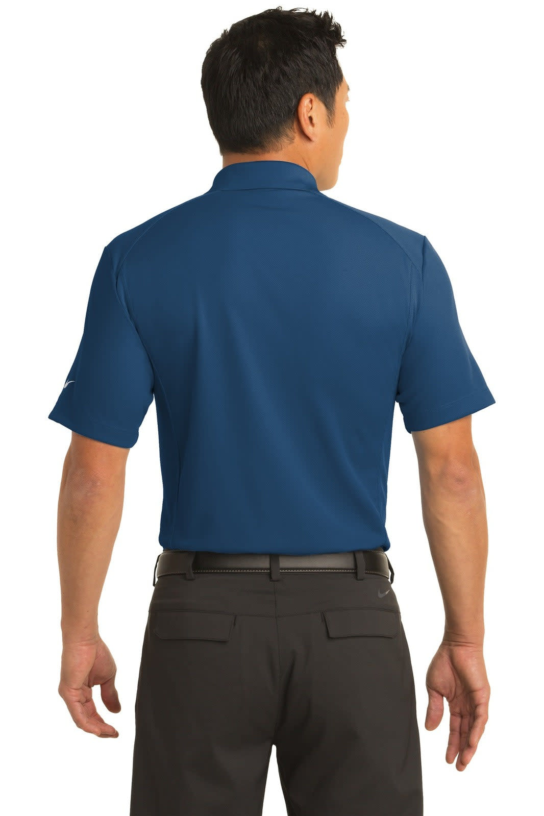 A man is wearing a blue Nike Dri-FIT classic polo shirt from the back, paired with dark trousers. The shirt features a logo.