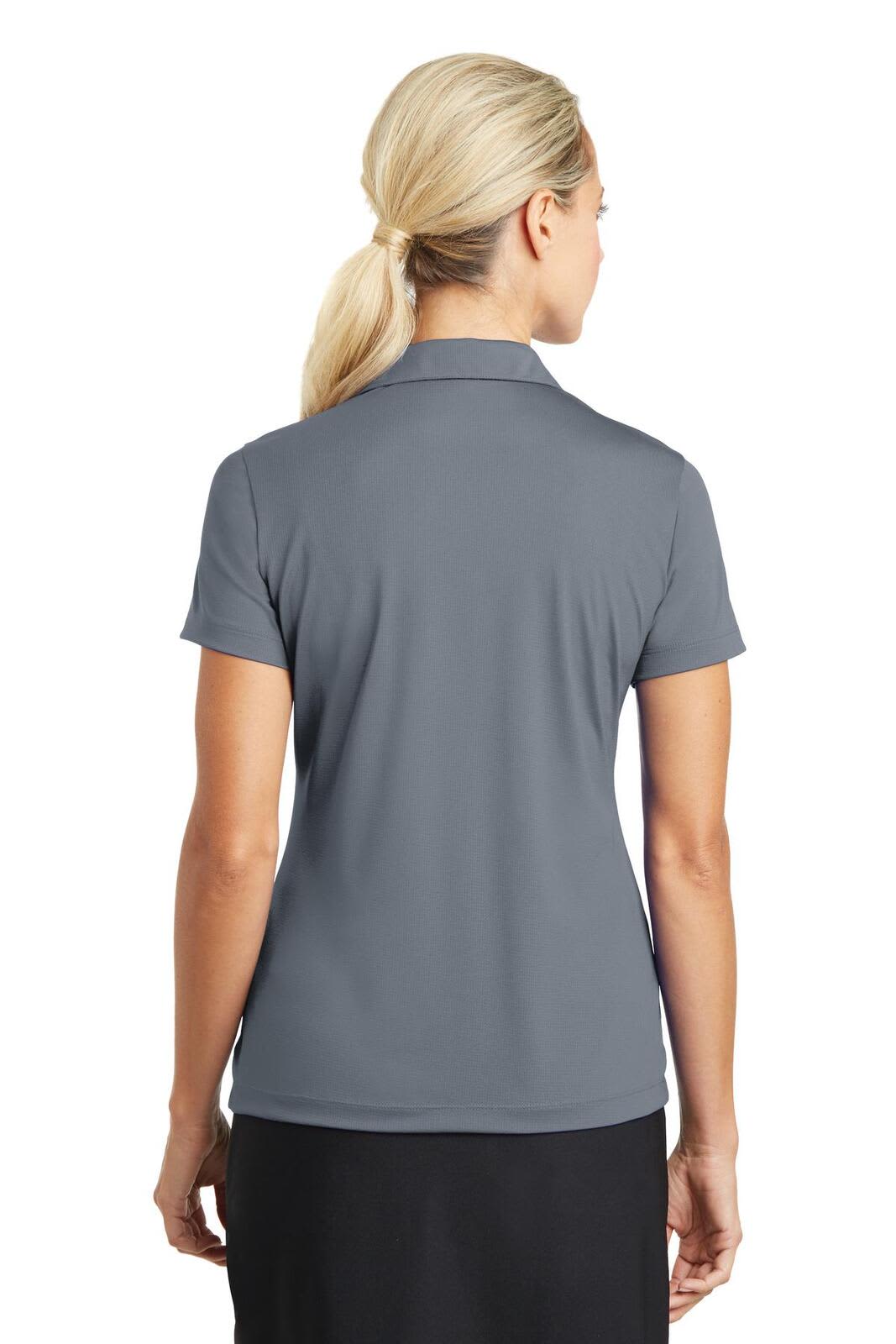 A grey Nike ladies Dri-FIT polo shirt, viewed from the back, featuring a collar and short sleeves.