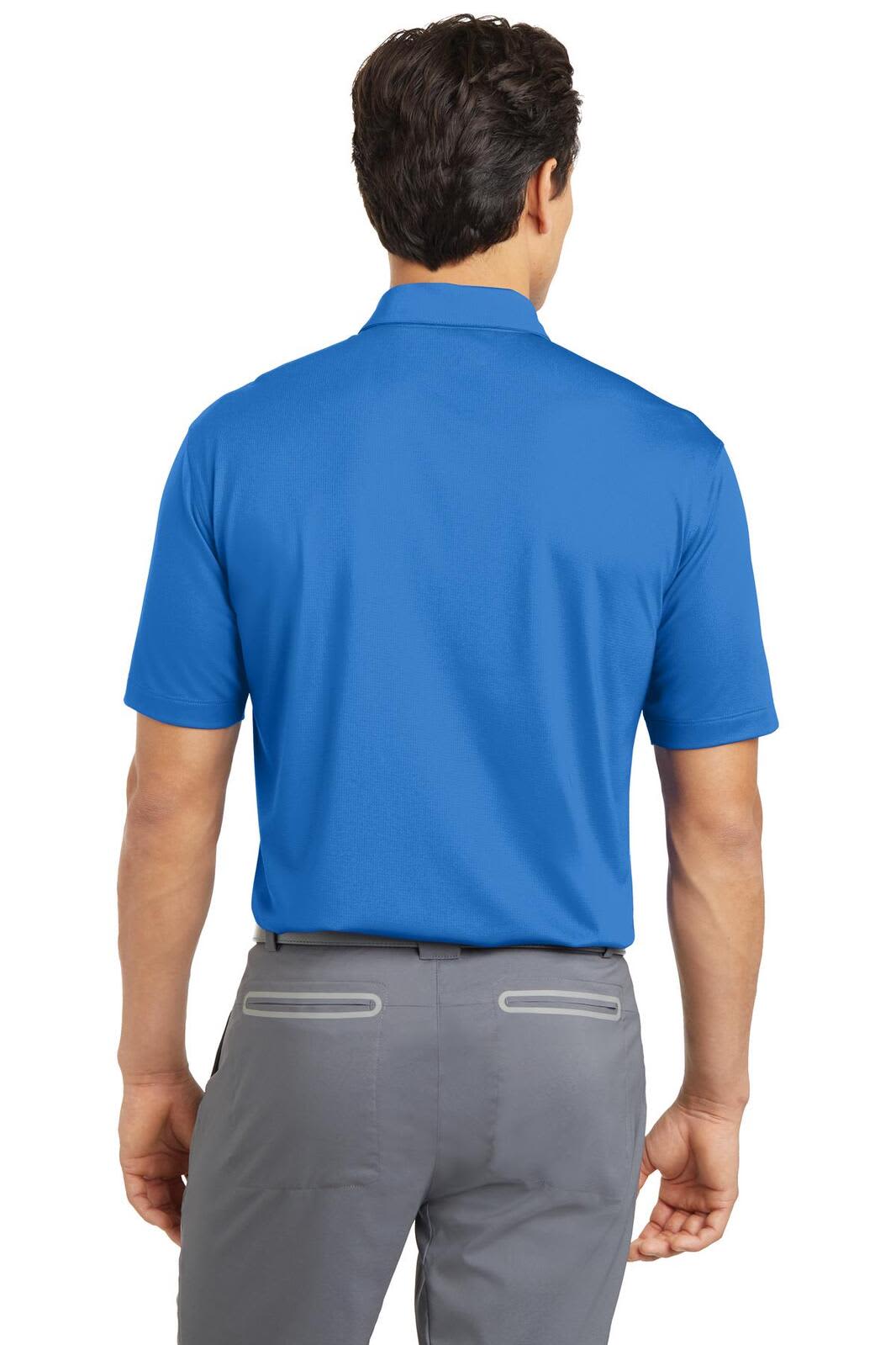 A blue Nike Dri-FIT polo shirt viewed from the back, paired with grey trousers, featuring a logo on the collar.