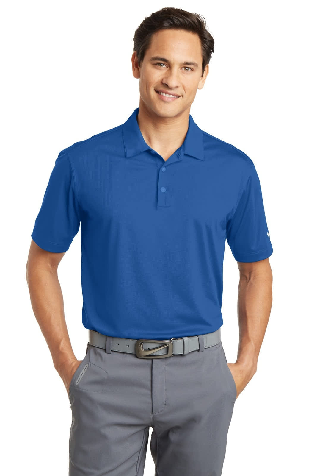 A blue Nike Dri-FIT Vertical Mesh Polo displayed on a male model, featuring a logo and paired with grey trousers.