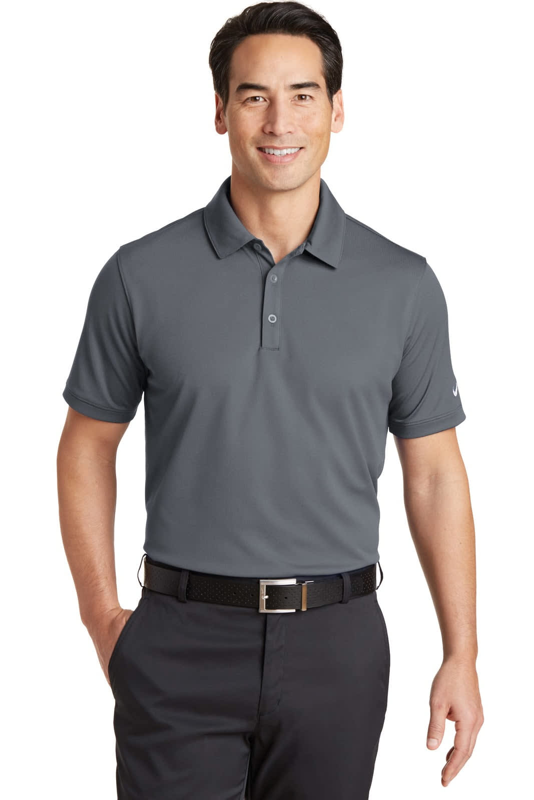 A grey polo shirt with a modern fit and a collar, worn by a smiling man, featuring a logo on the sleeve.