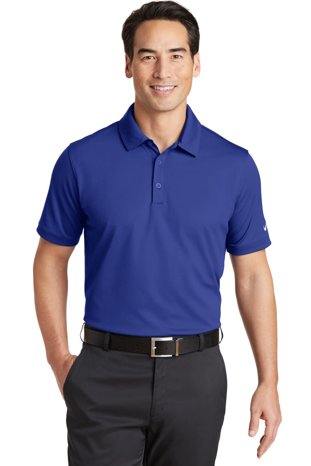 A purple Nike Dri-FIT Solid Icon Pique Modern Fit Polo worn by a smiling man, paired with black trousers.