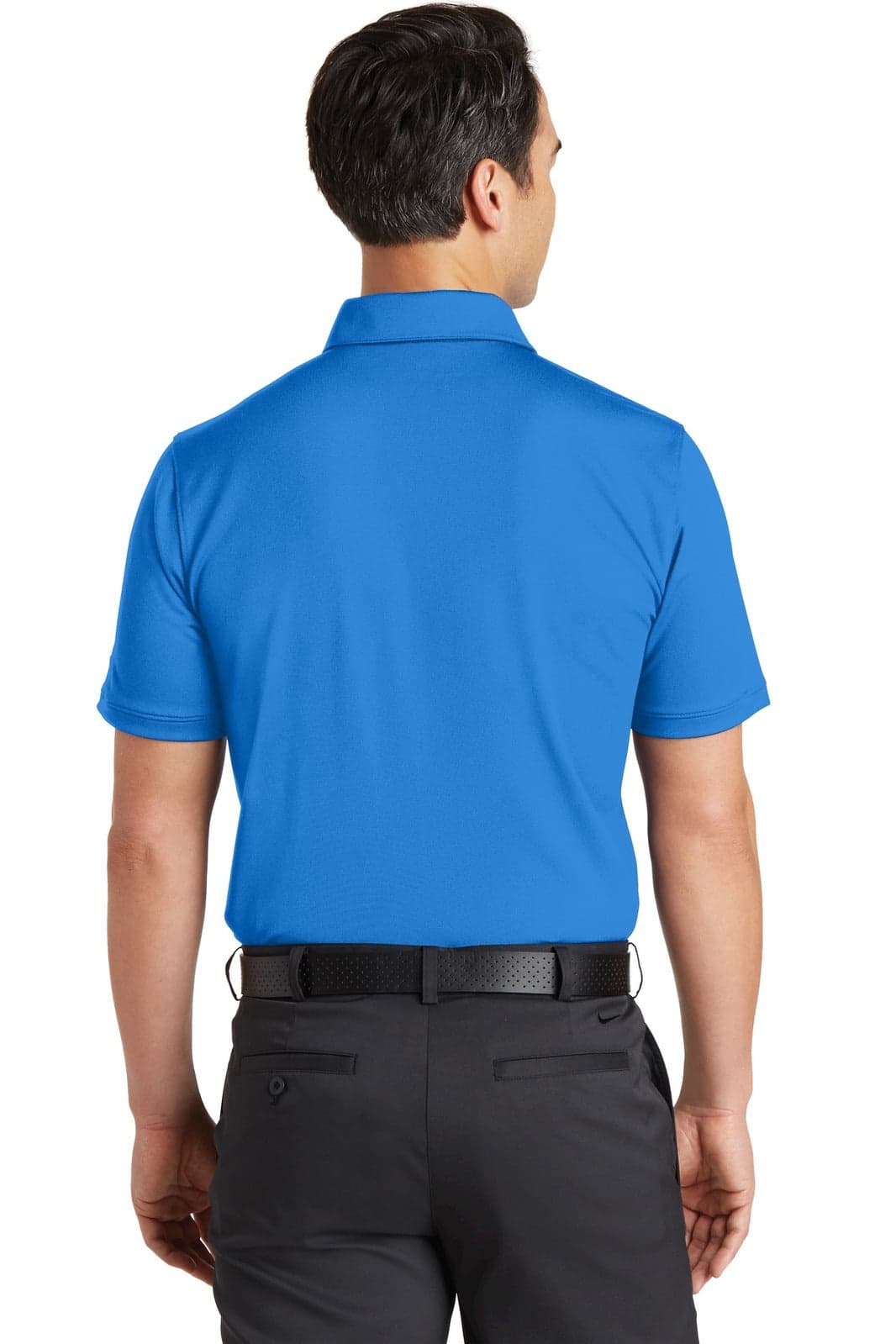A man wearing a blue Nike Dri-FIT polo shirt, viewed from the back, paired with dark trousers.