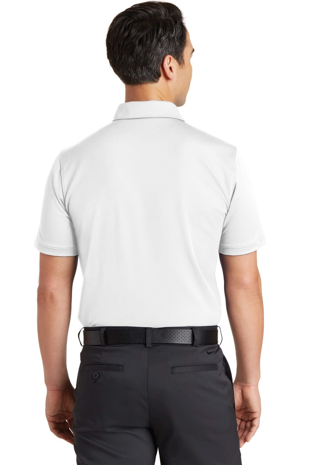 A back view of a white Nike Dri-FIT Solid Icon Pique Modern Fit Polo shirt, featuring a logo and paired with dark trousers.