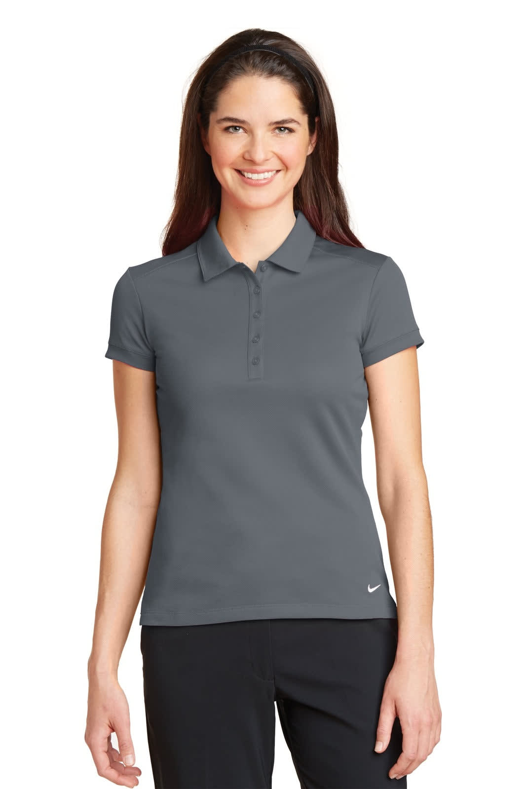 A grey Nike Ladies Dri-FIT polo shirt featuring a modern fit and a logo on the hem.