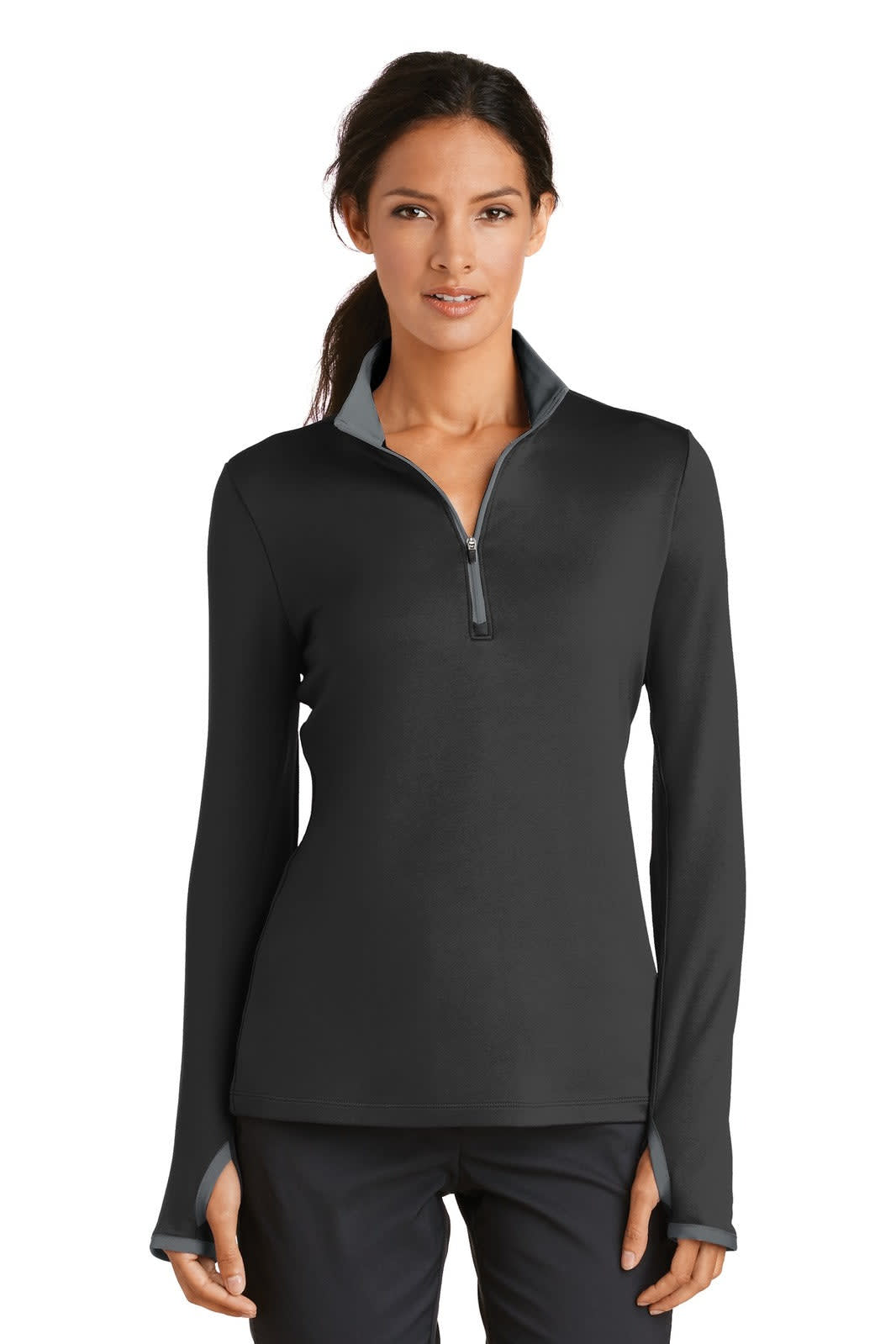 A black Nike ladies Dri-FIT stretch 1/2-zip cover-up with long sleeves and a zippered collar.