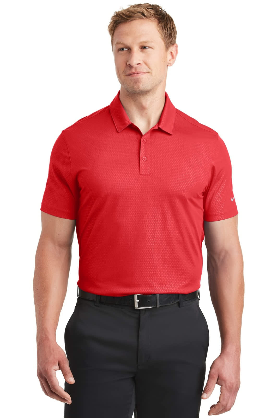A red Nike Dri-FIT Embossed Tri-Blade Polo shirt featuring a logo, displayed on a model wearing black trousers.