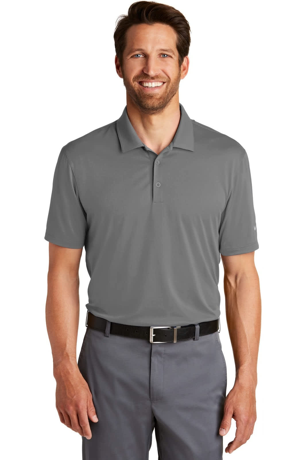 A grey Nike Dri-FIT Legacy Polo shirt on a man, paired with grey trousers, featuring a logo.