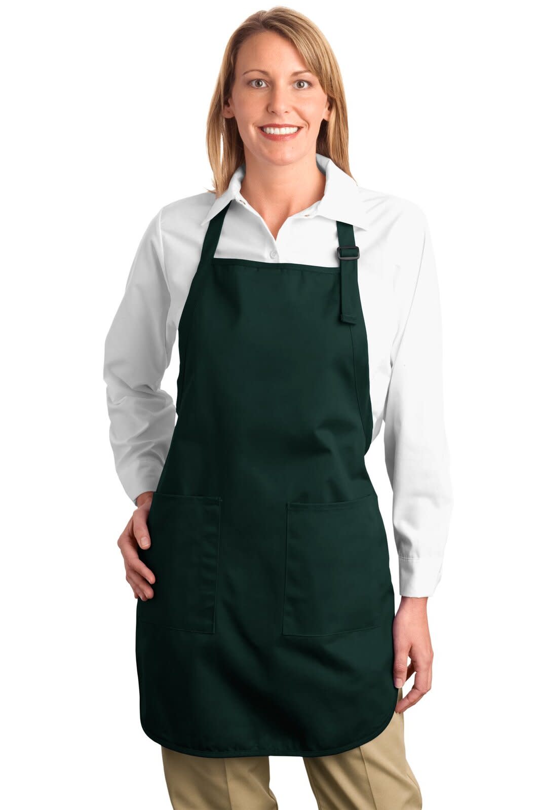 A green full-length apron with pockets, worn by a woman in a white shirt and beige trousers, featuring a logo.