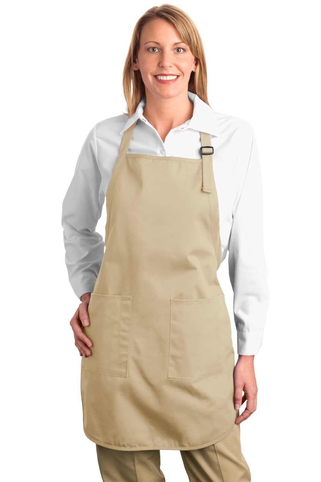 A light brown full-length apron with pockets, worn by a woman, featuring a logo.