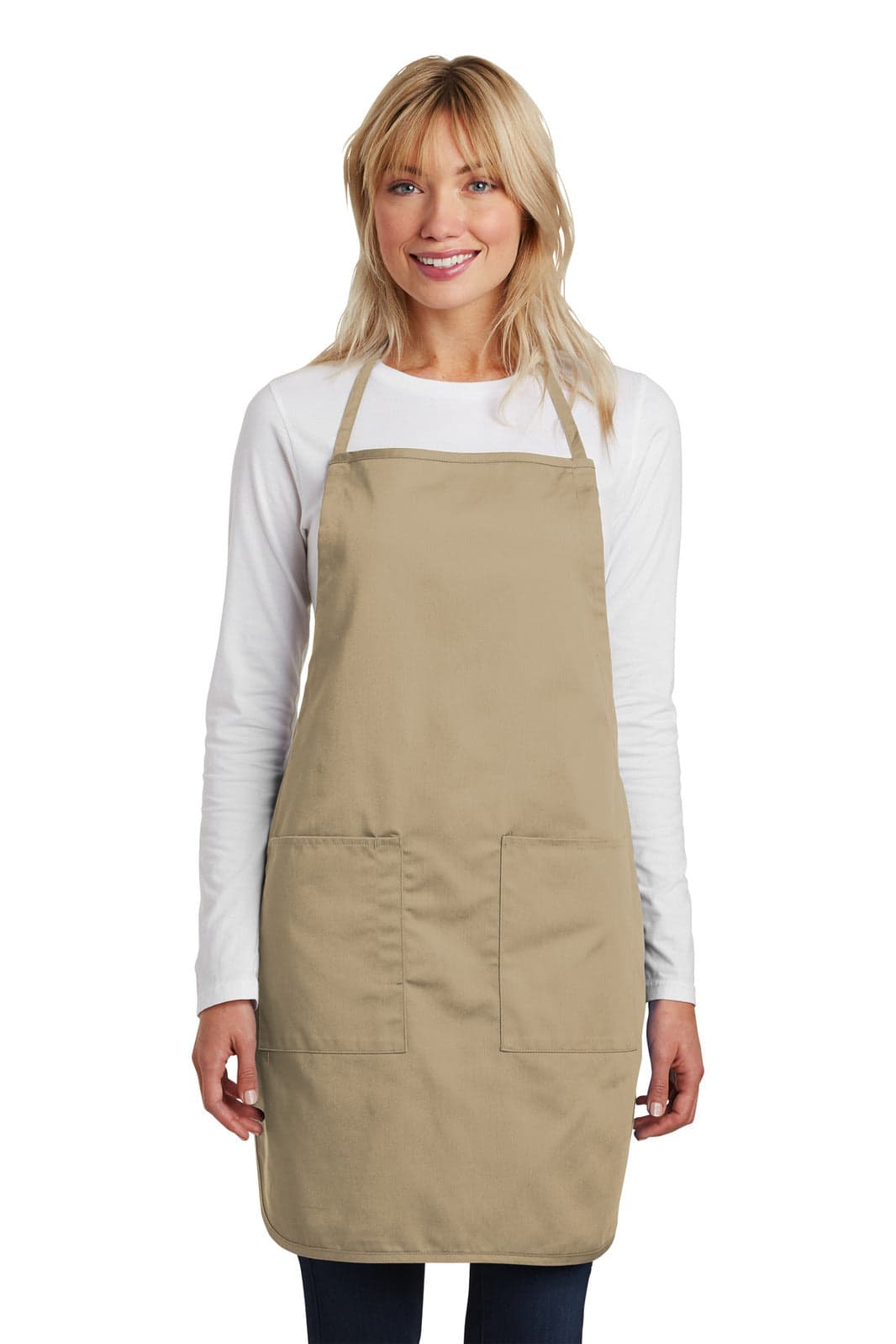 A woman wearing a beige full-length apron with pockets, standing against a plain background.