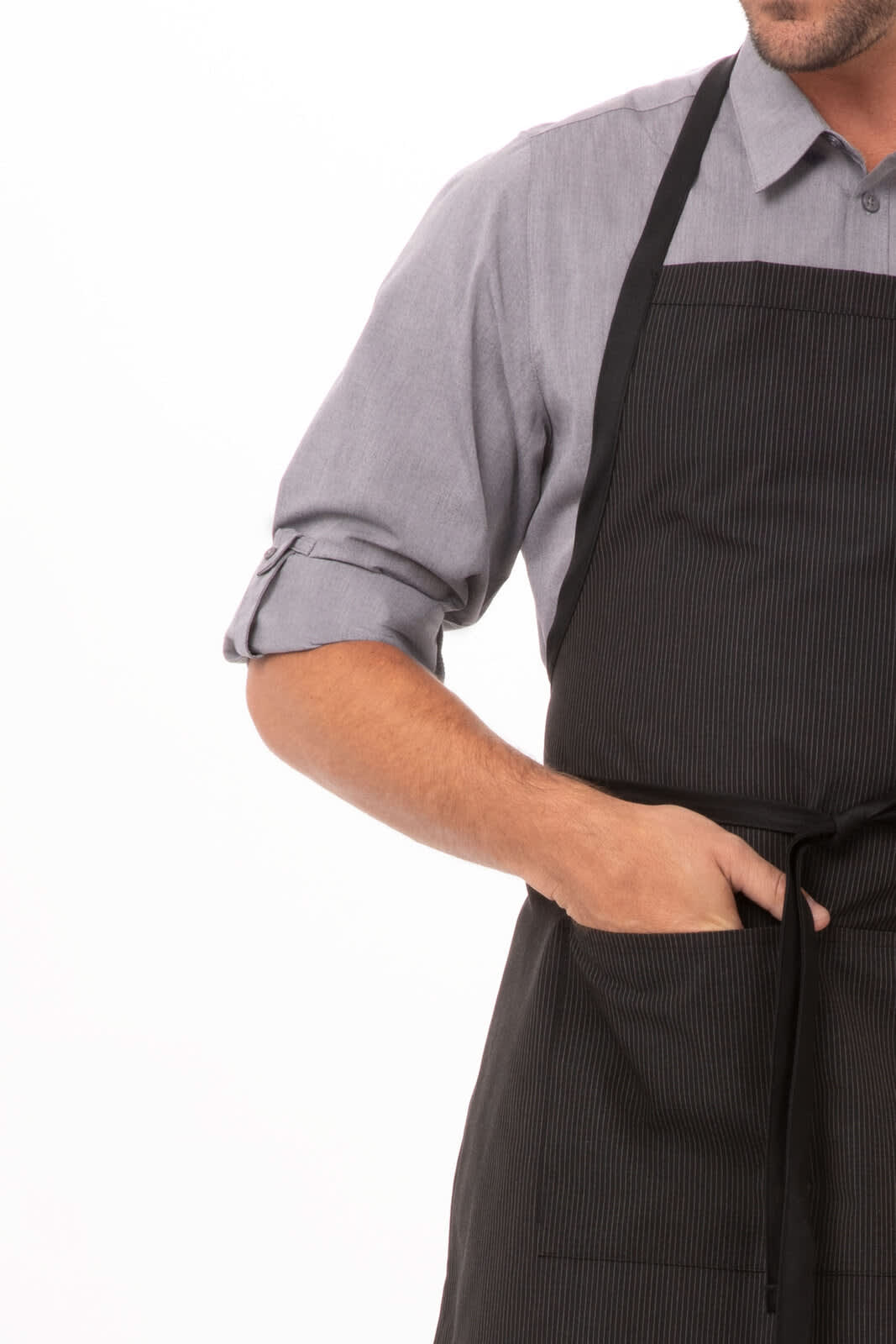 A black striped bib apron with contrasting ties, featuring a front pocket, displayed on a model.