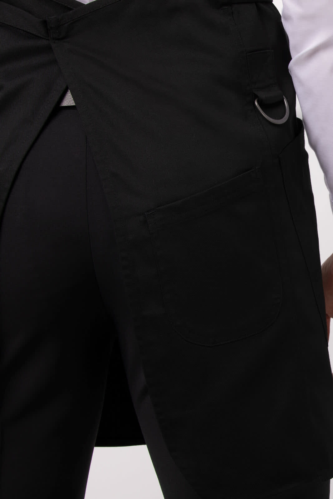 A black Largo Bib Apron with a pocket and a ring detail on the side, showcasing its workwear design.