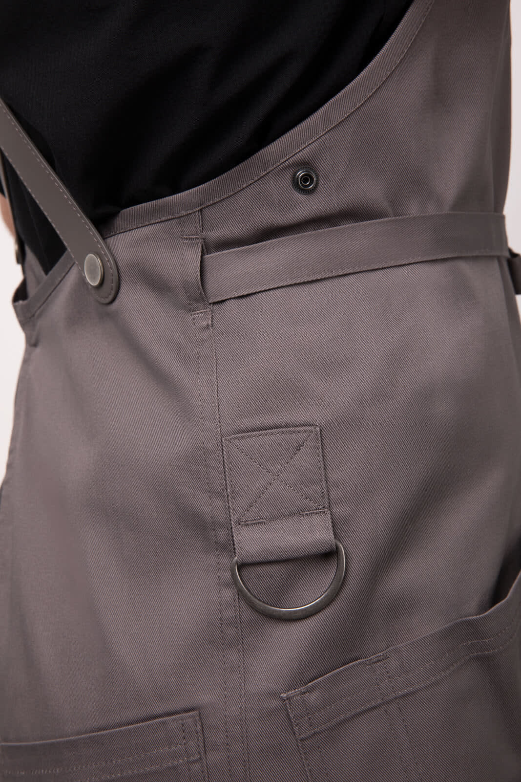 A grey Largo Bib Apron featuring a side pocket, adjustable straps, and a logo.