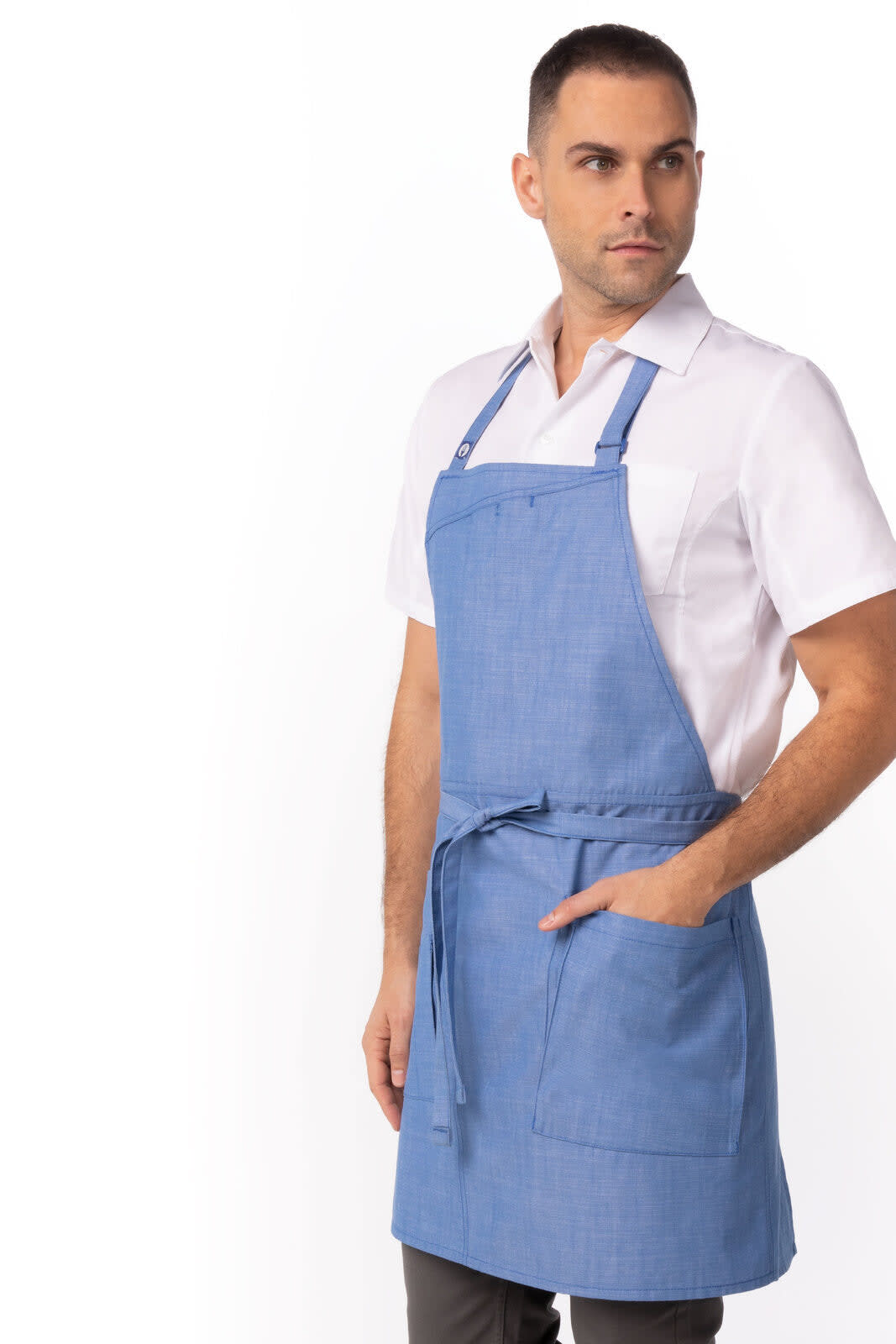 A blue apron worn by a model, featuring adjustable straps and a front pocket, with a logo on it.