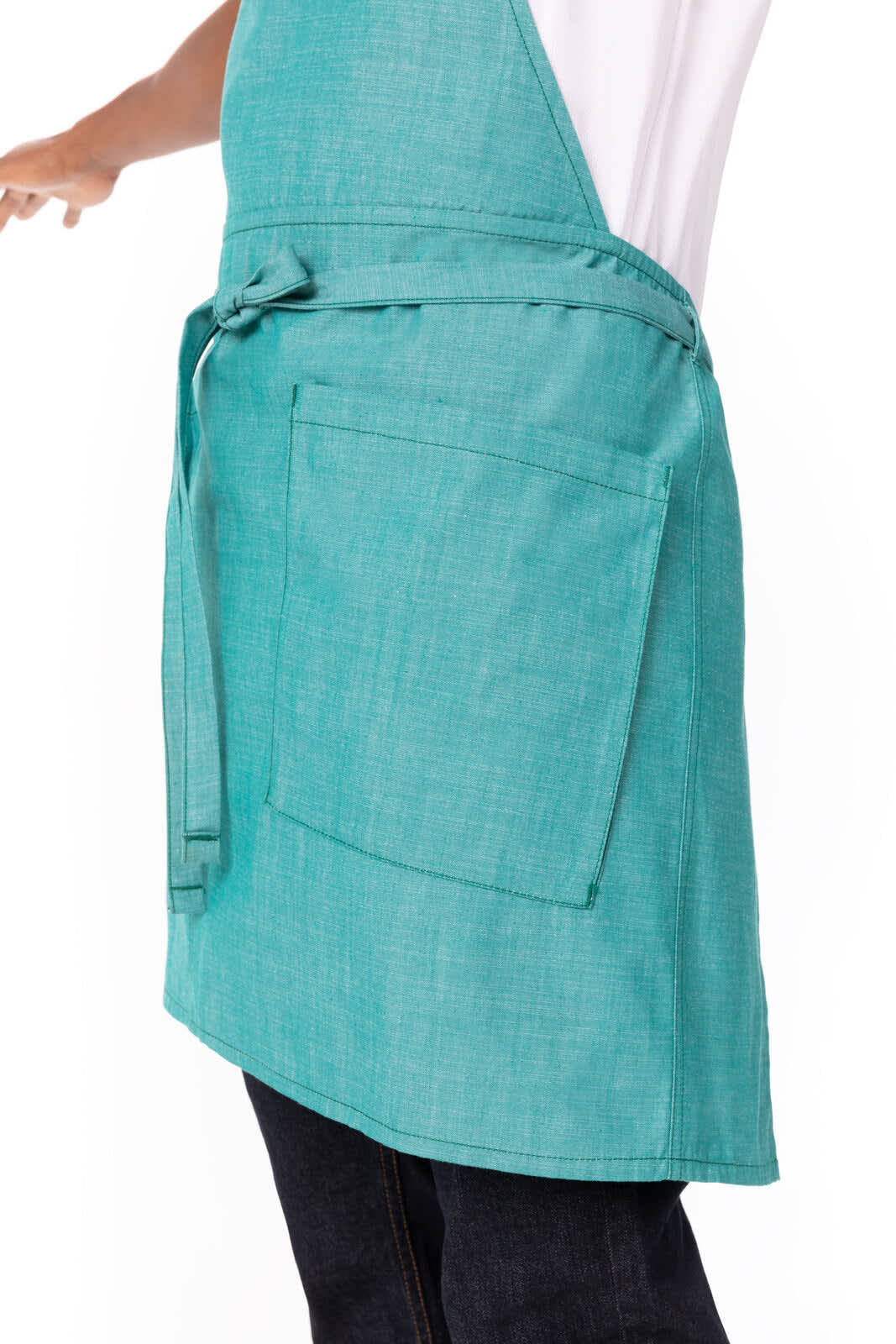 A turquoise bib apron featuring a waist tie and a pocket, designed for workwear.