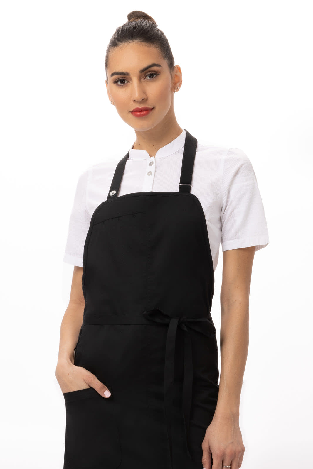 A black Brio Bib Apron worn by a model, featuring a stylish design and a logo.