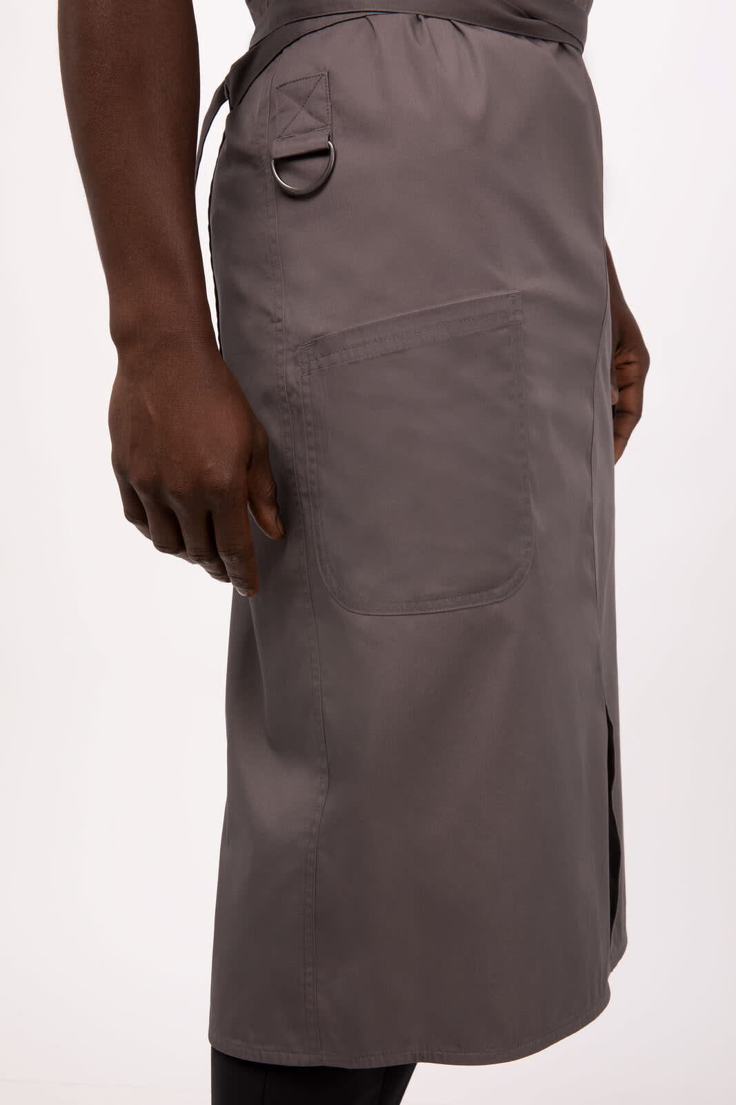 A grey bib apron featuring a pocket and an adjustable waist tie, with a loop for hanging tools.