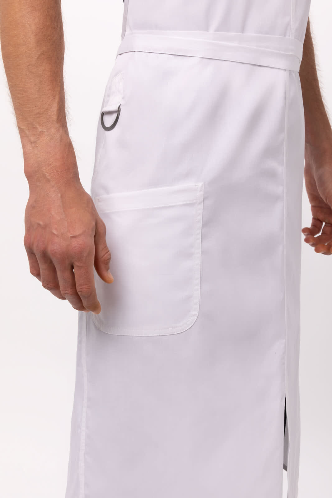 A white bib apron featuring a side pocket and a loop, highlighting its durable design for workwear.