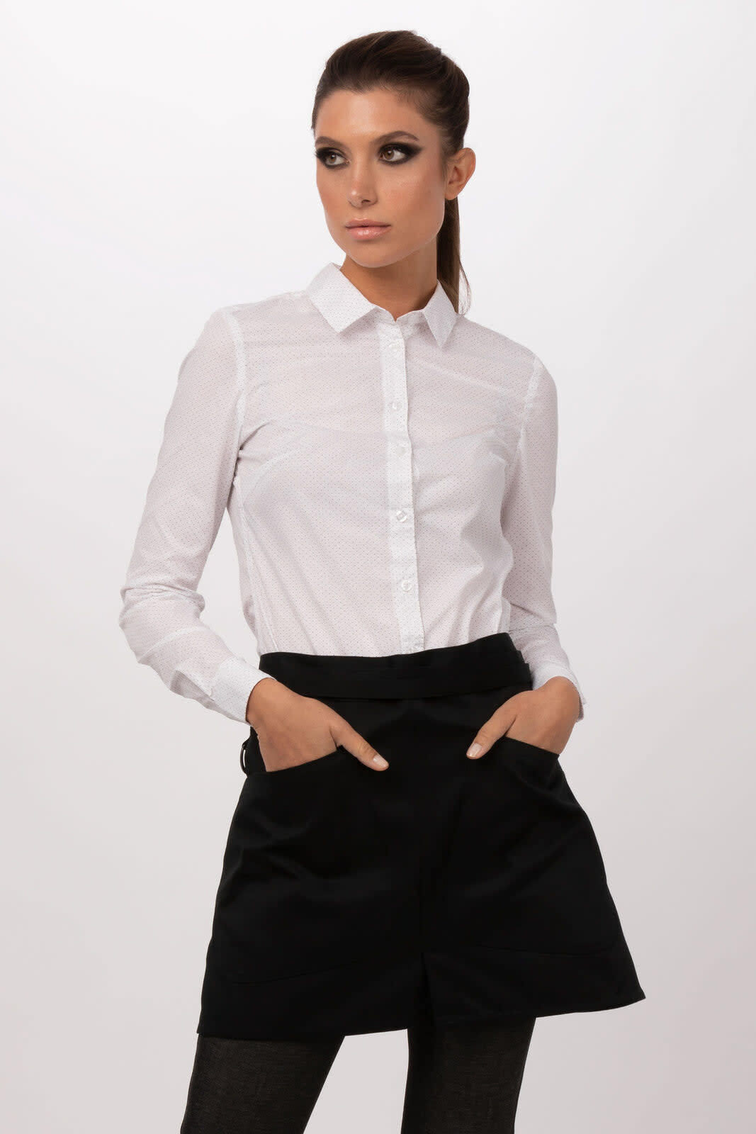 A model wears a black half bistro apron over a white shirt, featuring two front pockets and a brand logo.
