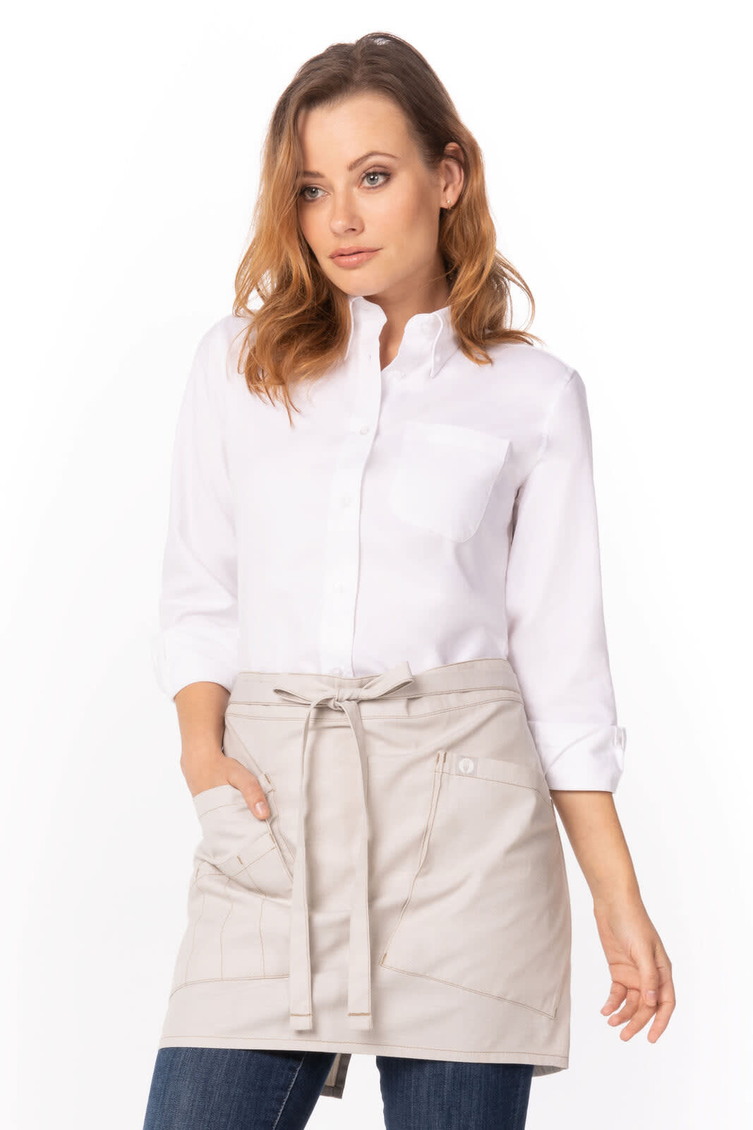 A light grey bistro apron with pockets, worn over a white shirt and jeans by a model. It features a logo.
