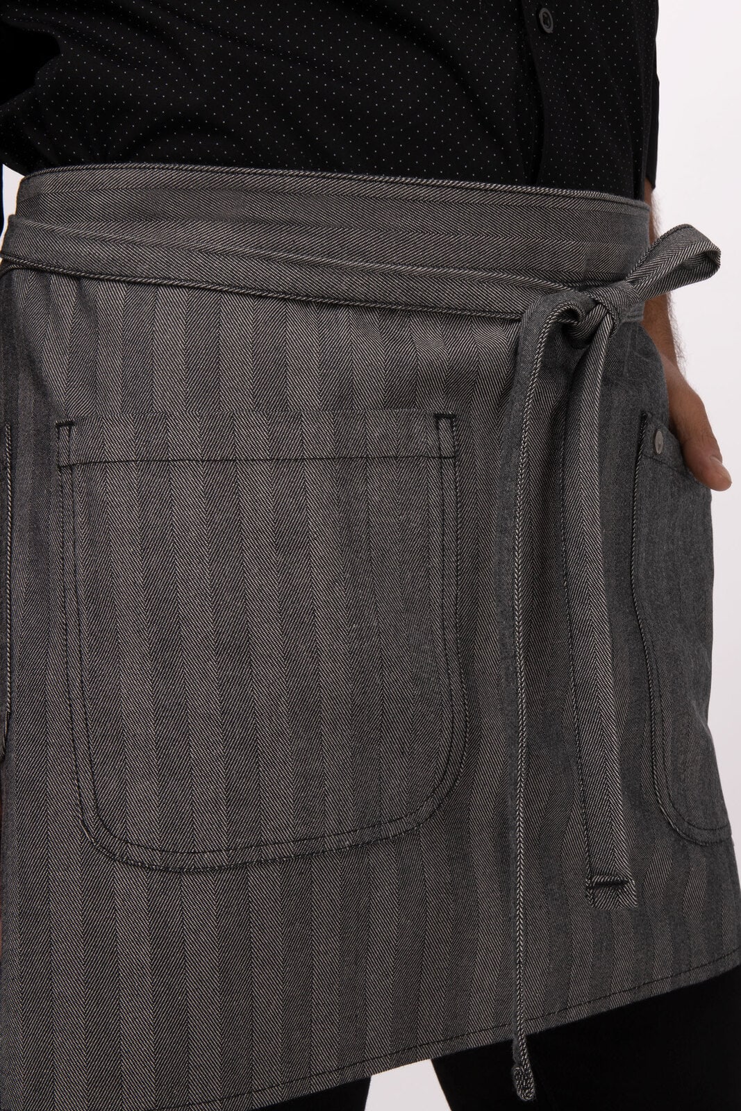 A grey striped bistro apron with a tie waist and two front pockets, featuring a logo.