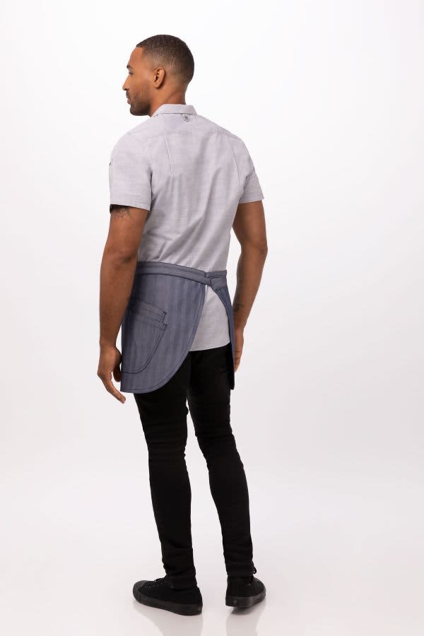 A grey and navy striped bistro apron worn by a man, showcasing the back view of the garment.