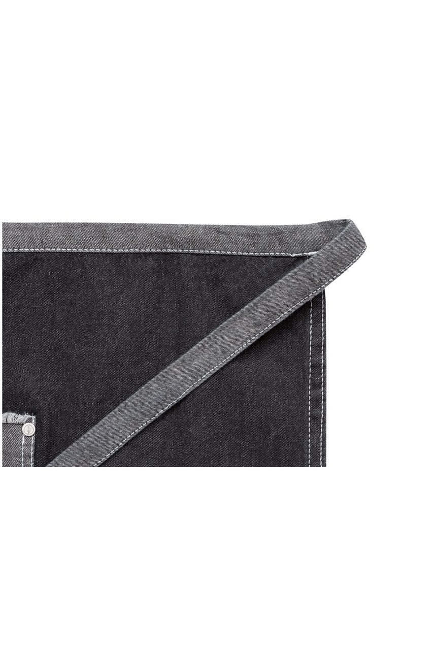 A dark denim half bistro apron with contrasting grey detailing and a pocket. Features a logo on the pocket.