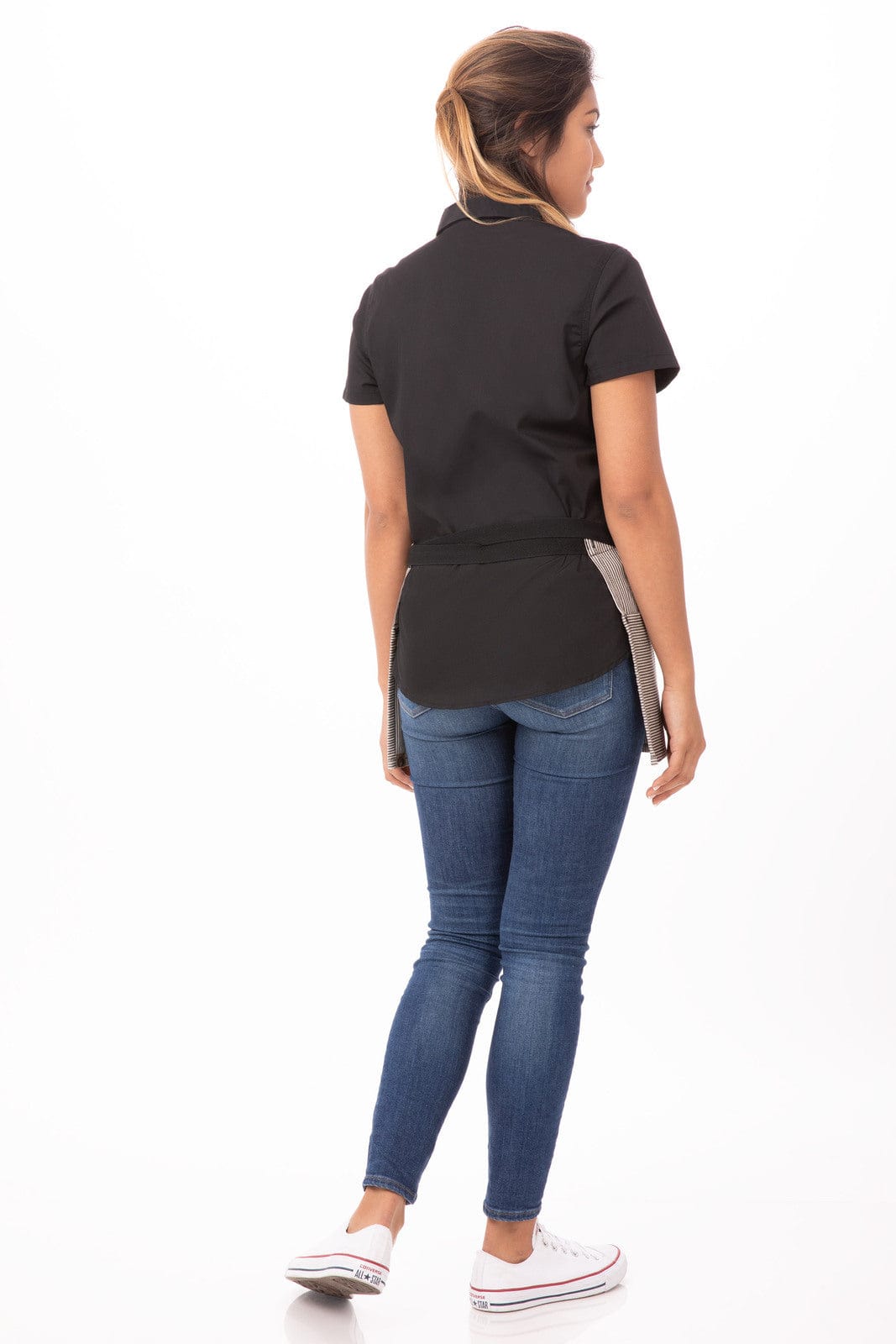 A waist apron in black with a light grey pocket, worn by a model from the back, paired with blue jeans.