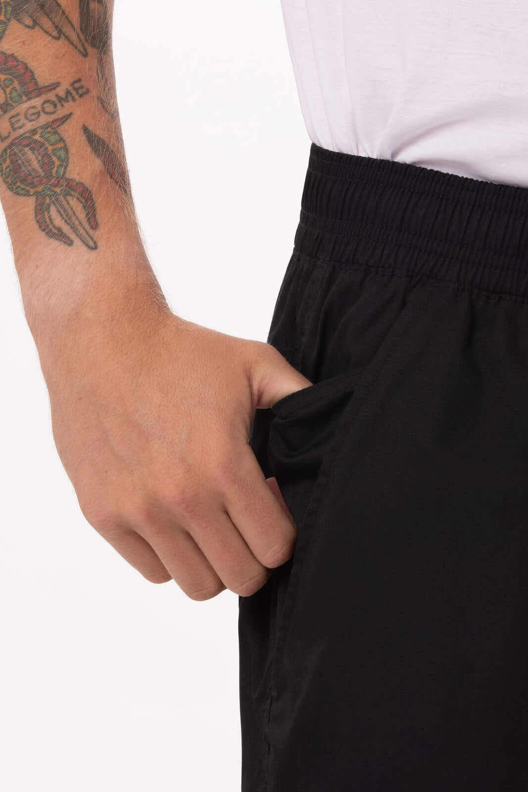 Lightweight black baggy pants with an elastic waistband and a hand in the side pocket, featuring a tattooed arm.