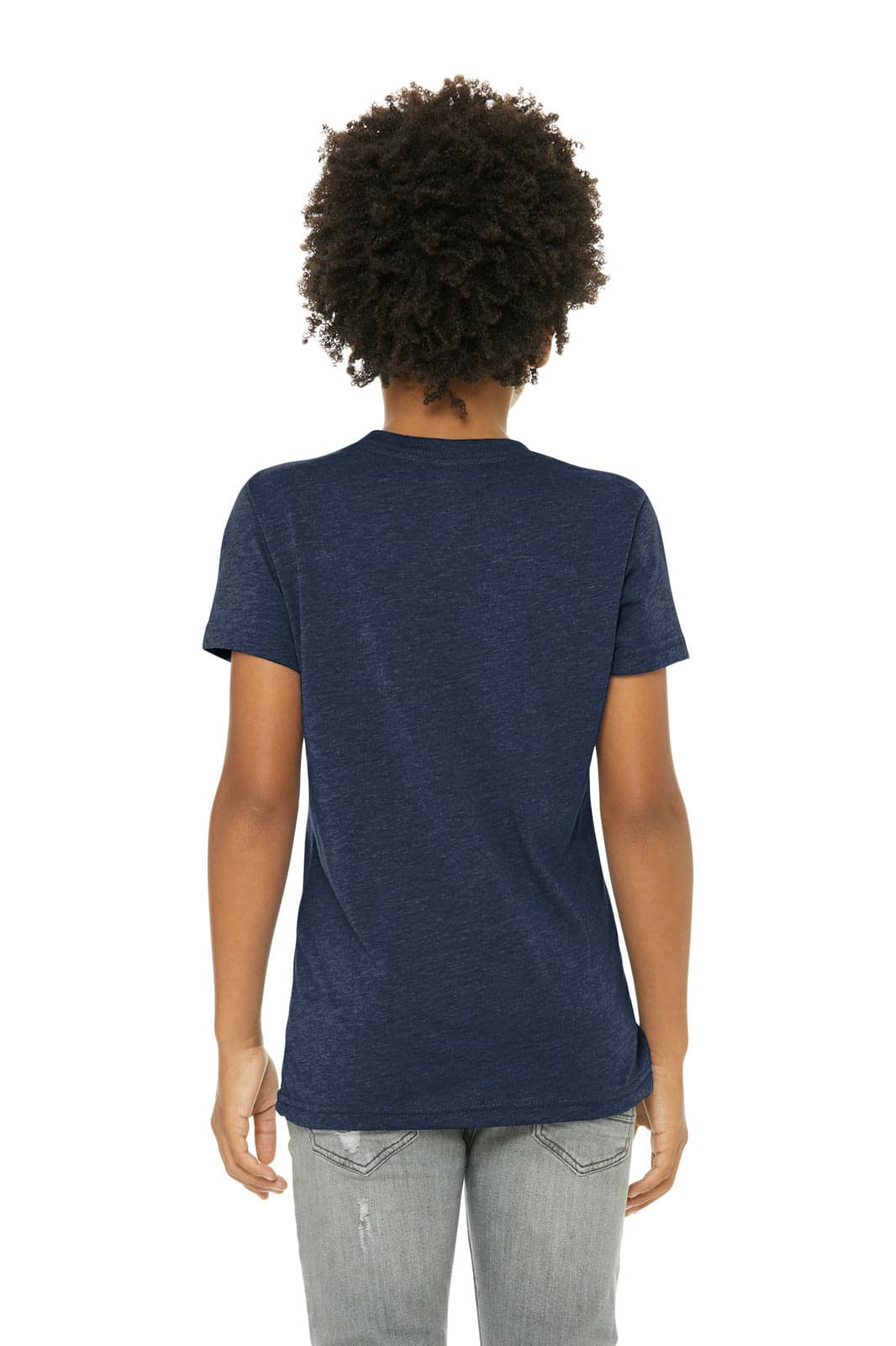A young person wearing a navy blue short sleeve t-shirt from the back, with curly hair and light jeans.