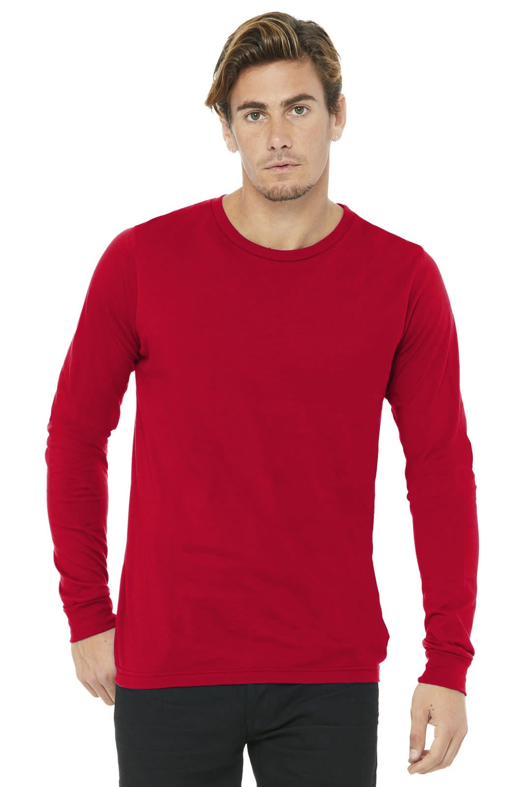 A red unisex long sleeve tee with a round neckline and fitted sleeves, featuring a small logo.