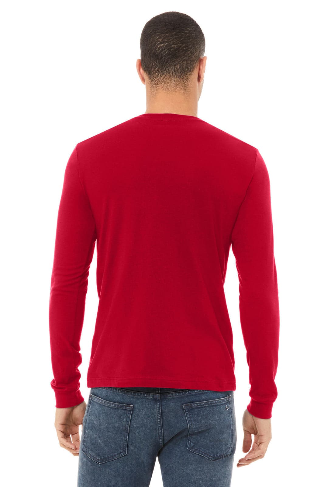 A red unisex long sleeve tee with a solid back view, featuring a logo. Worn with blue jeans.