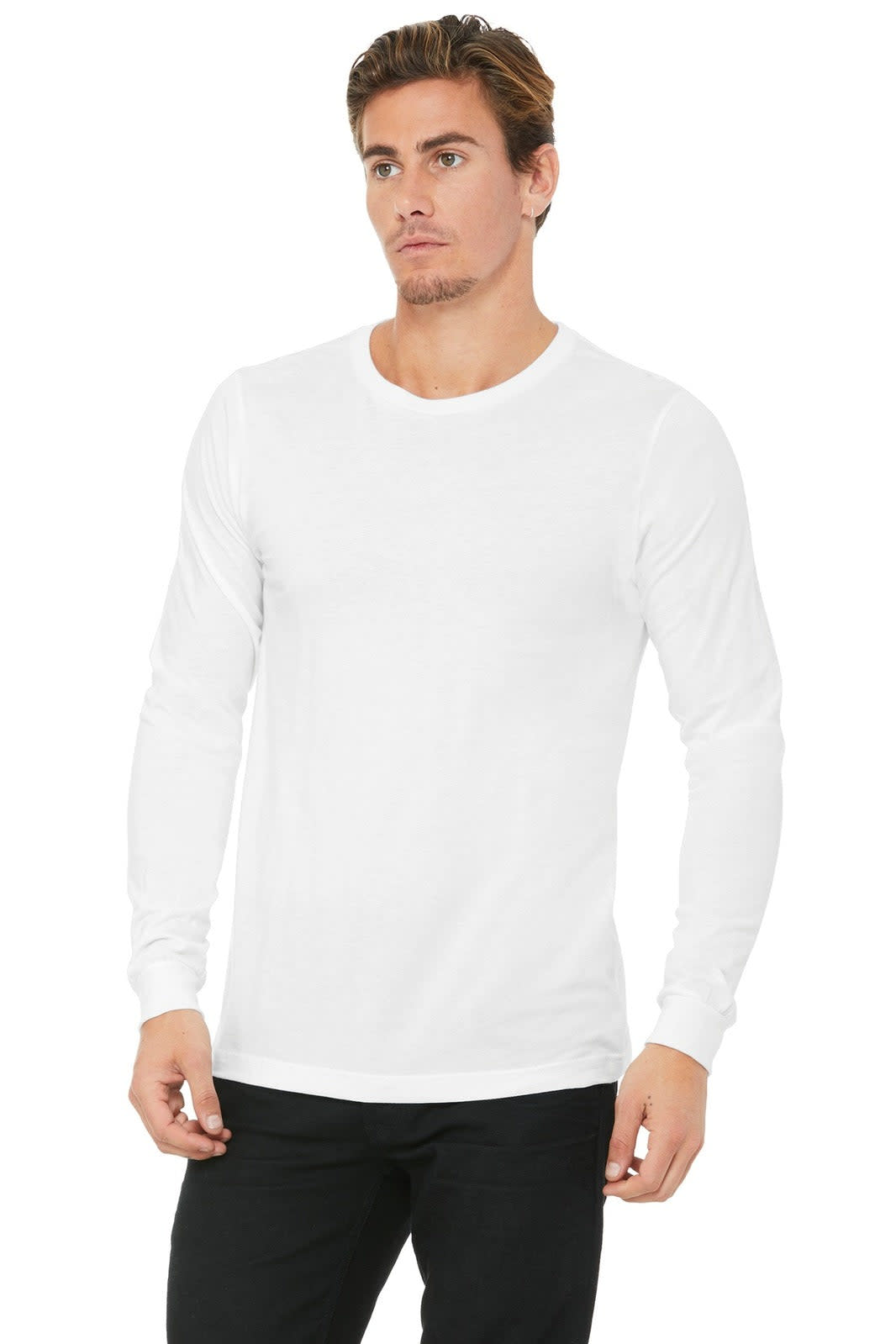 A model wearing a white unisex long sleeve tee, styled with black pants. The shirt has a logo on it.