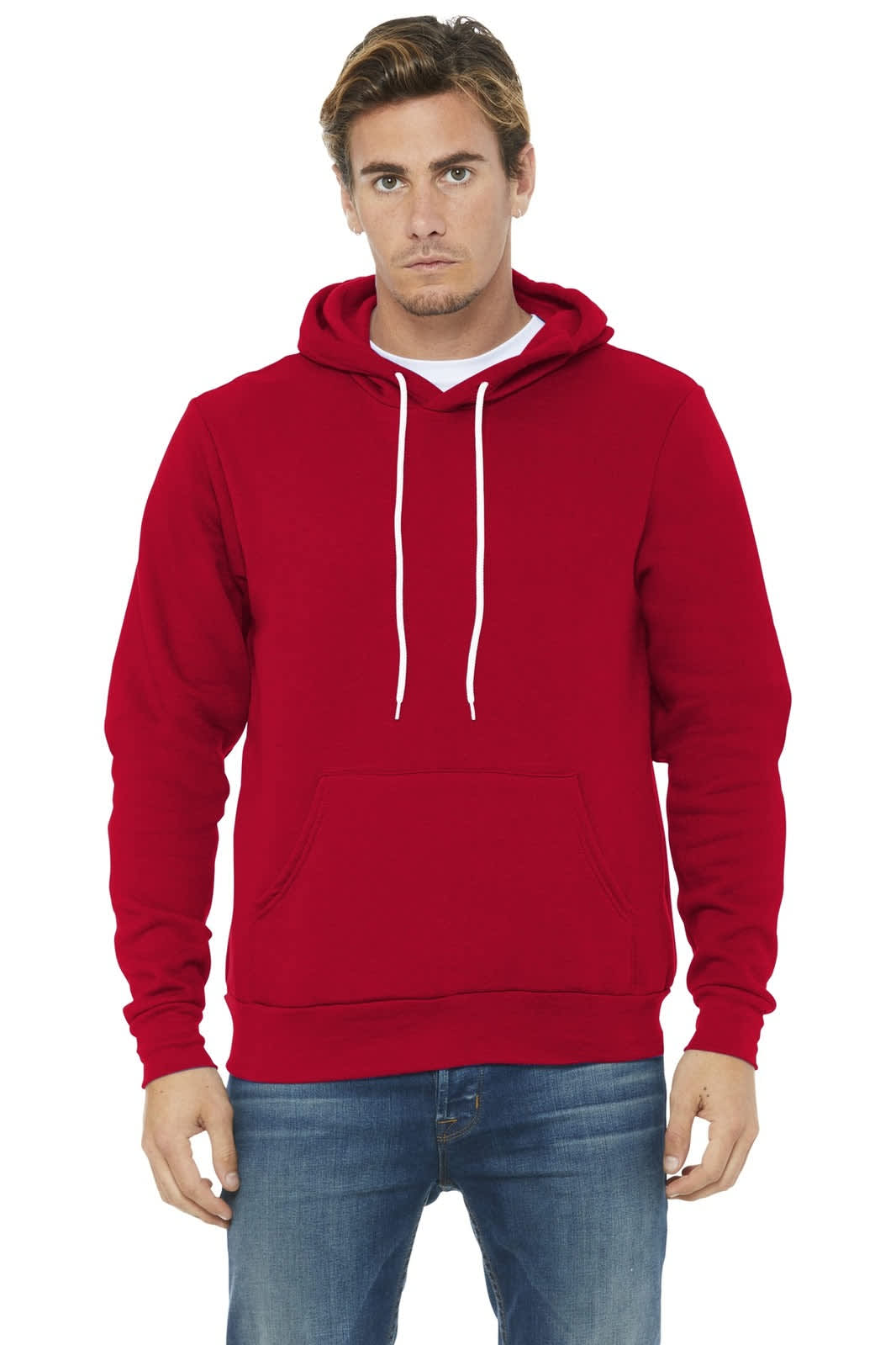 A red unisex sponge fleece pullover hoodie with a front pocket and drawstring hood, modelled by a man.
