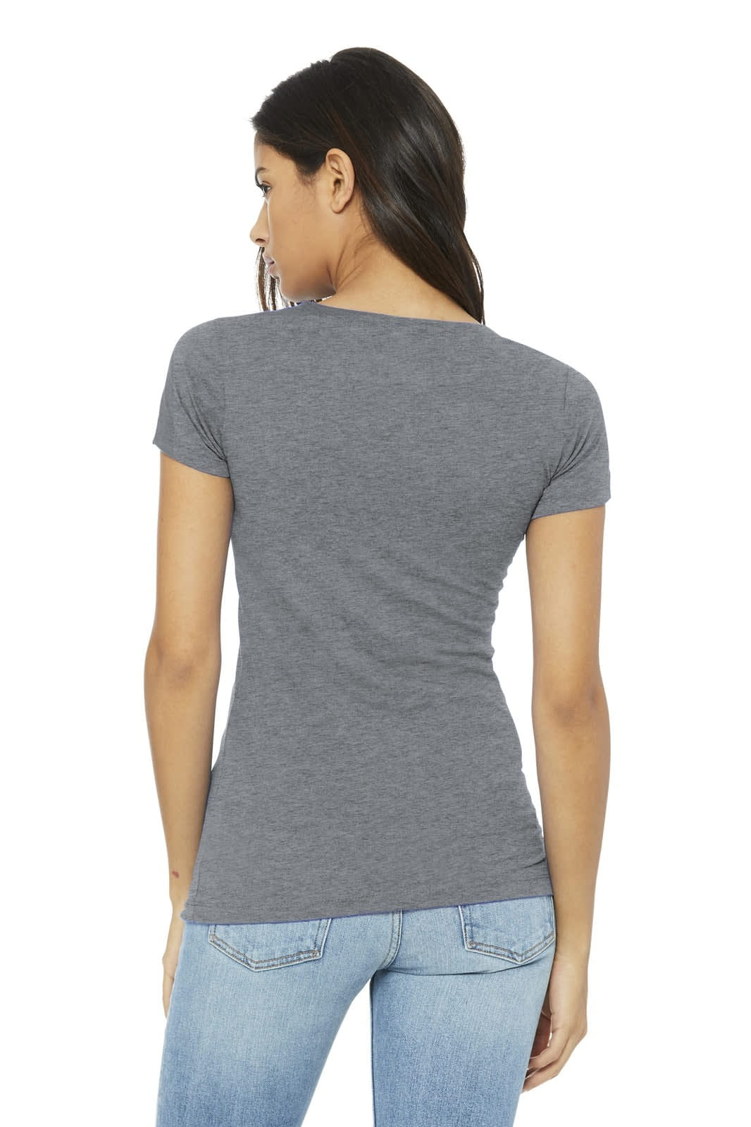 A woman wearing a grey t-shirt, viewed from the back, paired with light blue jeans. The shirt has a logo.