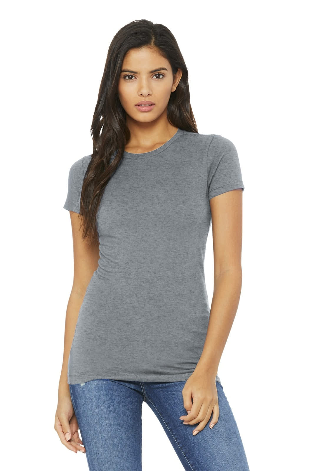 A woman wearing a fitted grey t-shirt paired with blue jeans. The shirt has branding present.