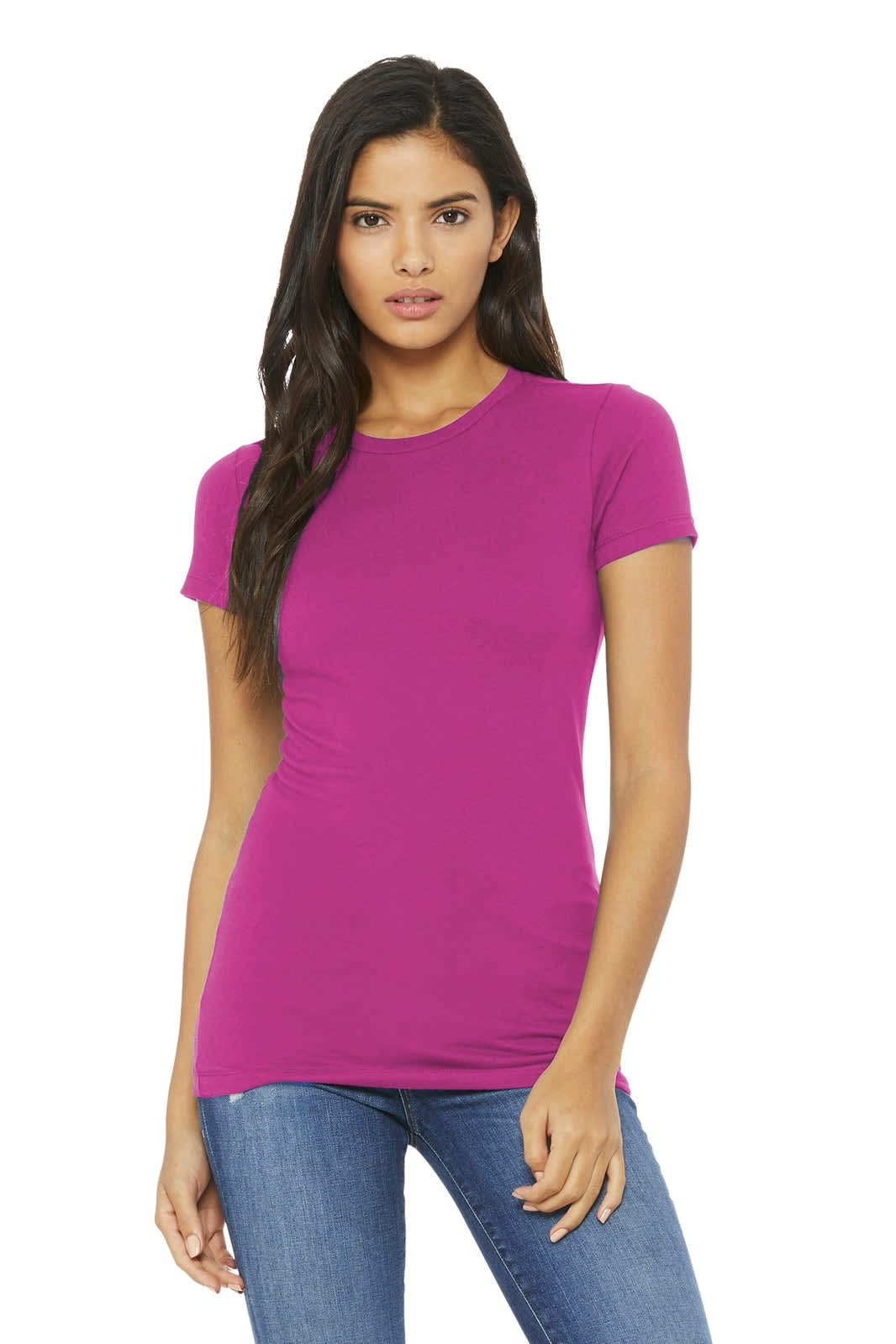 A woman models a fitted, short-sleeved tee in bright pink, paired with blue jeans. The shirt features a logo.