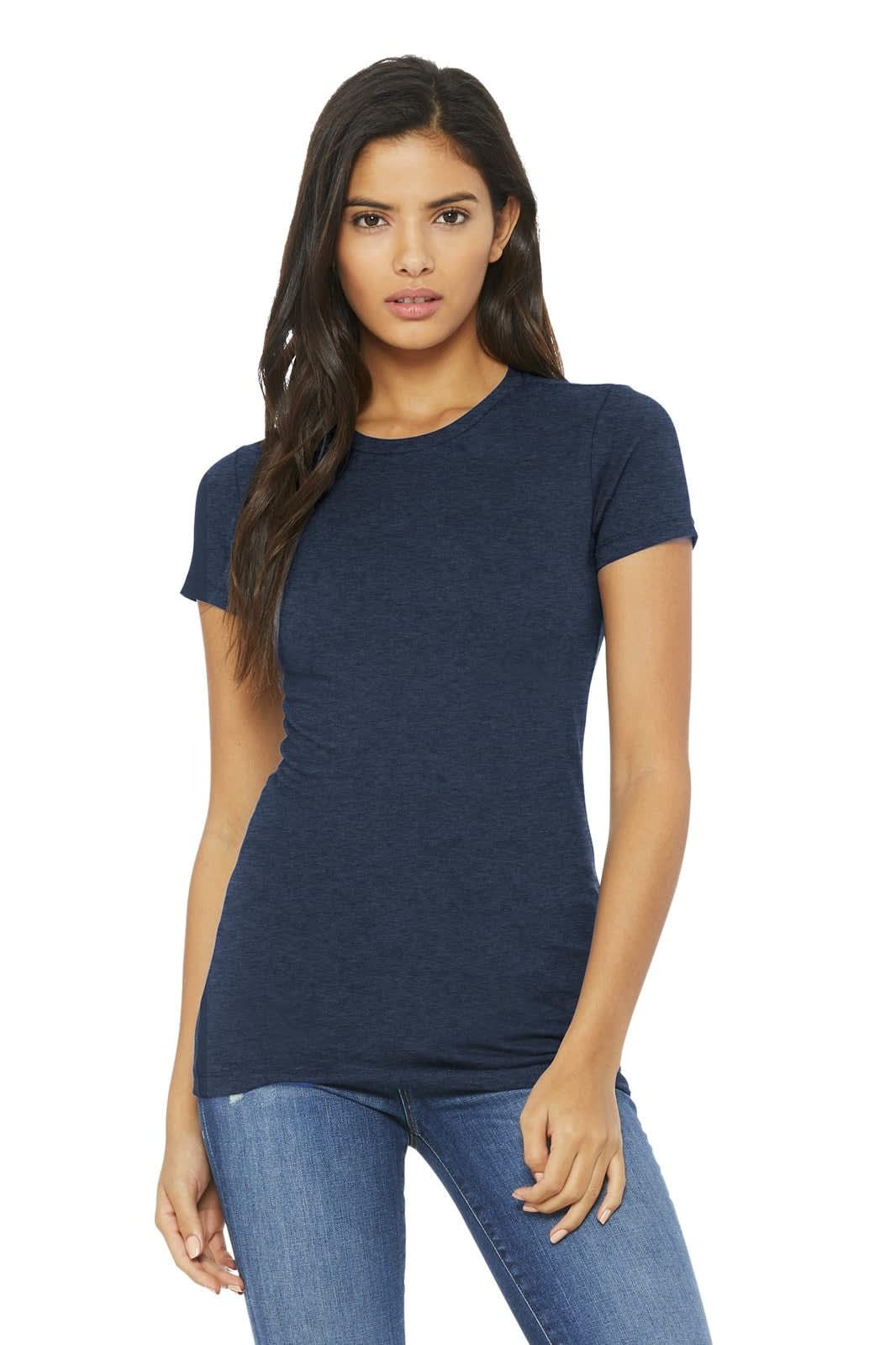 A woman in a navy blue short-sleeve t-shirt poses, wearing jeans. The t-shirt features a logo.