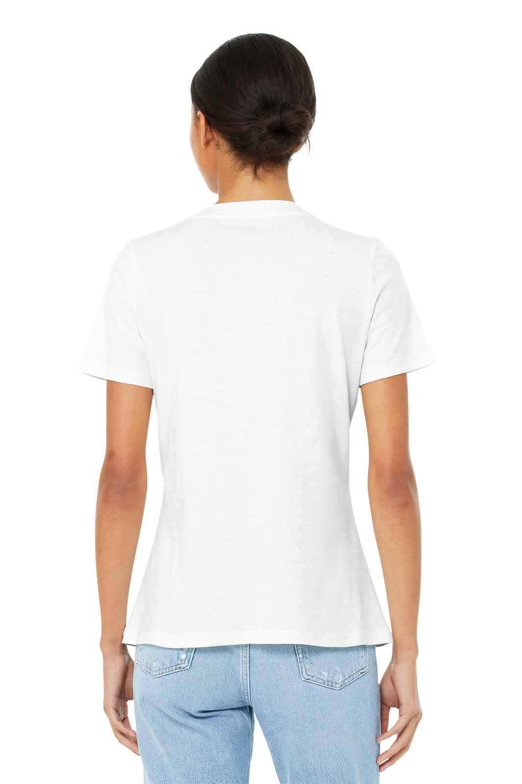 A woman is seen from the back wearing a white relaxed jersey short sleeve V-neck tee. The tee has a subtle logo.